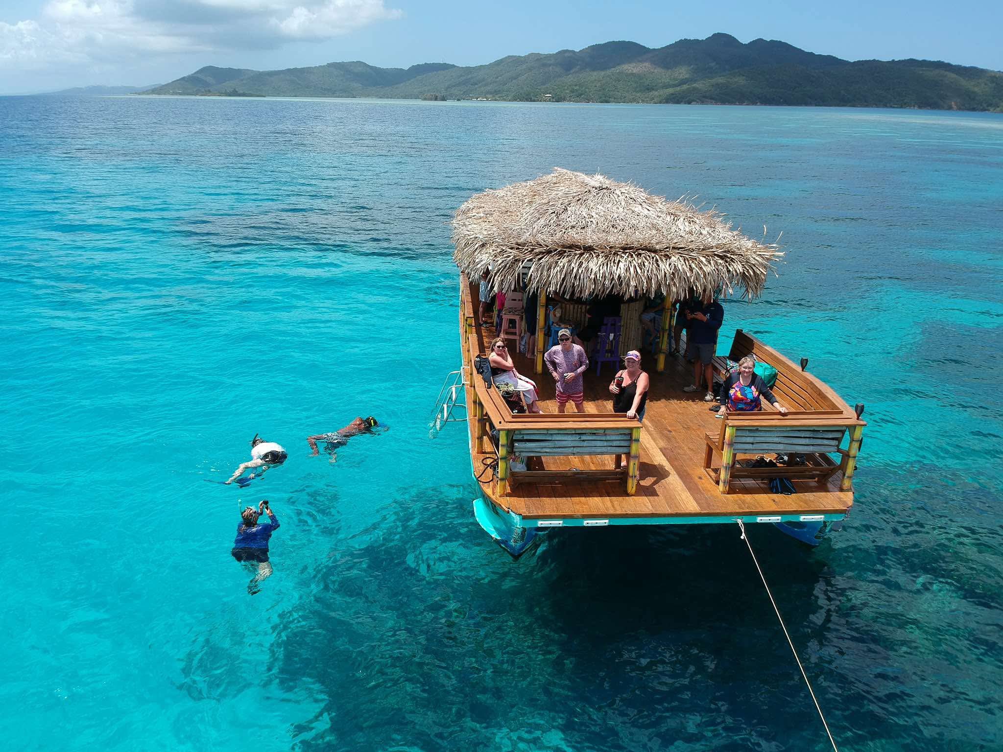 Why a Tiki Boat Cruise Is the Most Unique Way to See Roatan